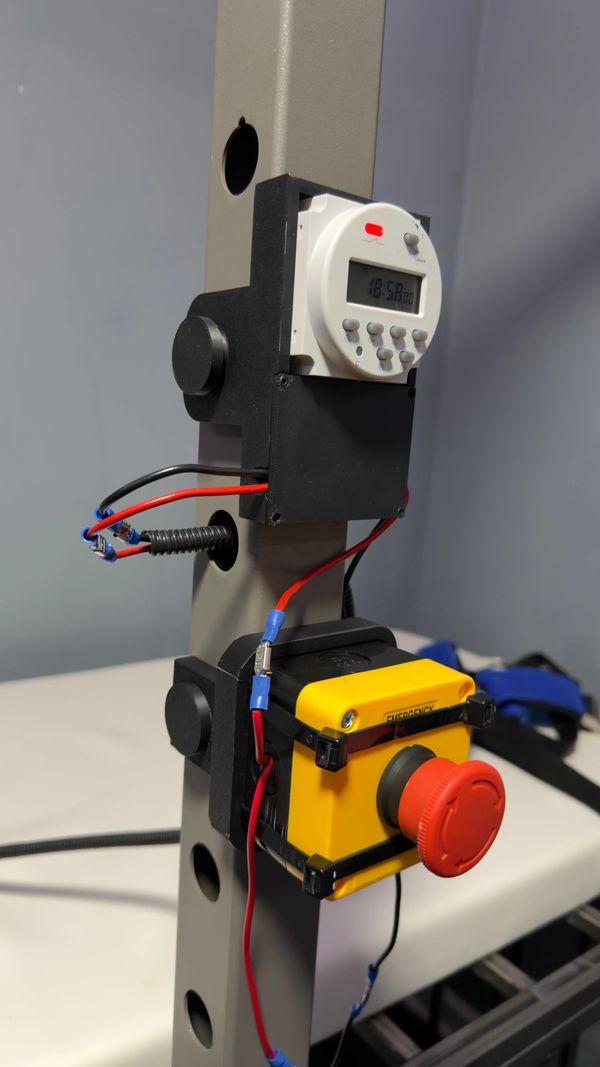 Closeup of the digital timer and the emergency stop button.